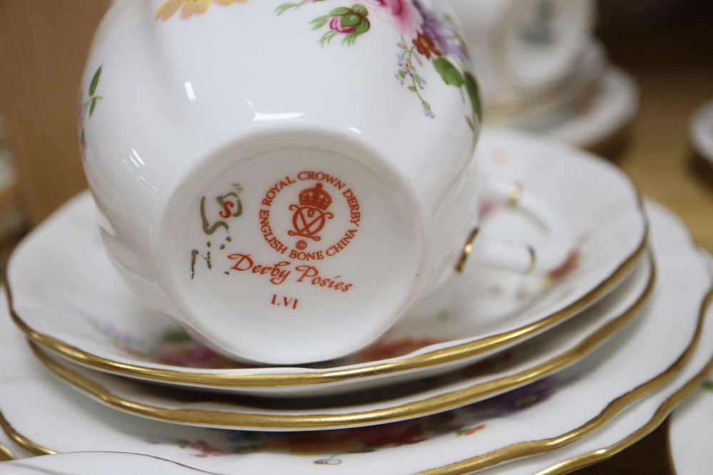 A Royal Crown Derby Derby Posies 25-piece part tea service and a Wedgwood Hathaway Rose part coffee service,